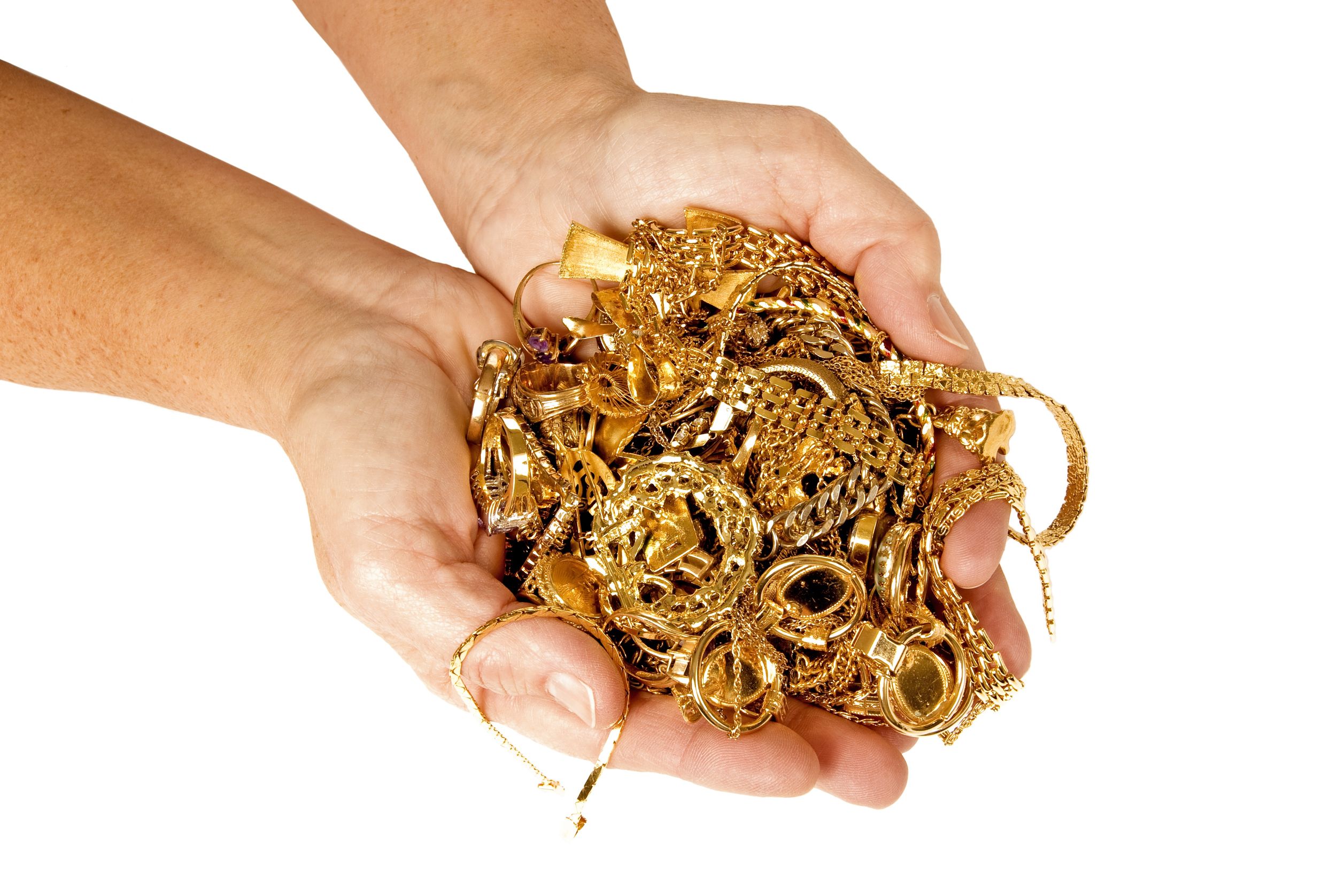 Image of hands holding a pile of gold jewelry