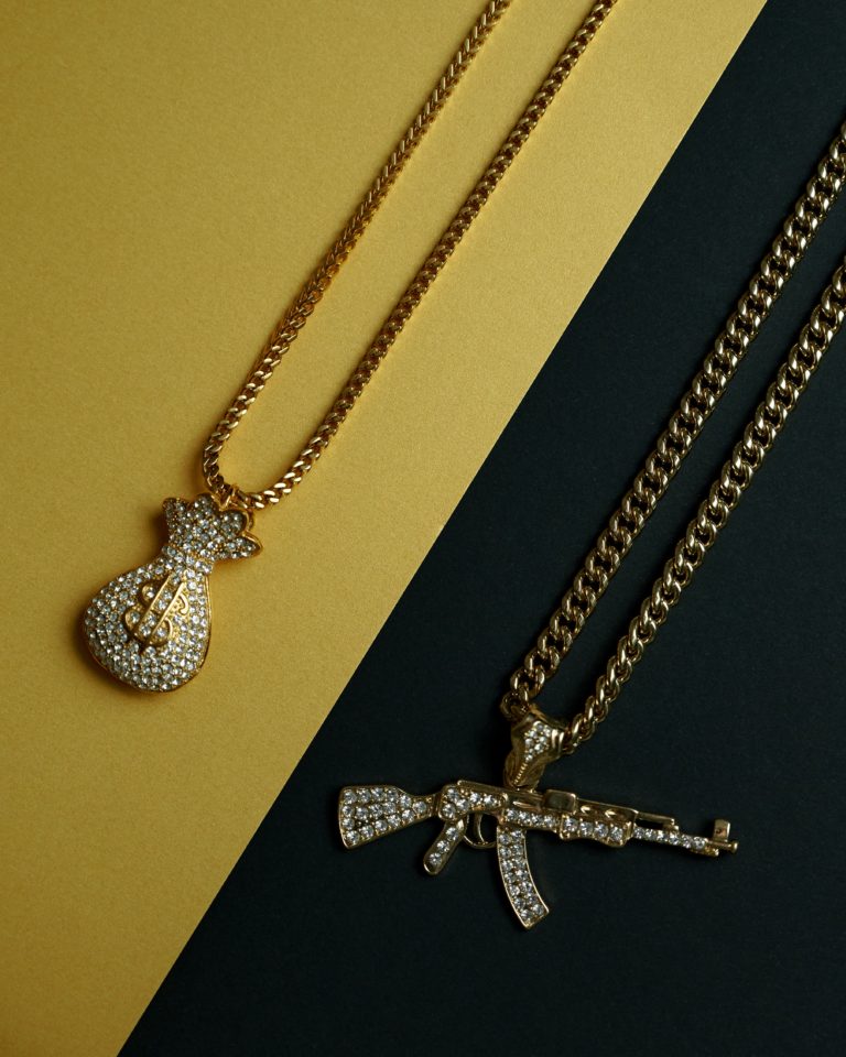 Two gold chains with pendants