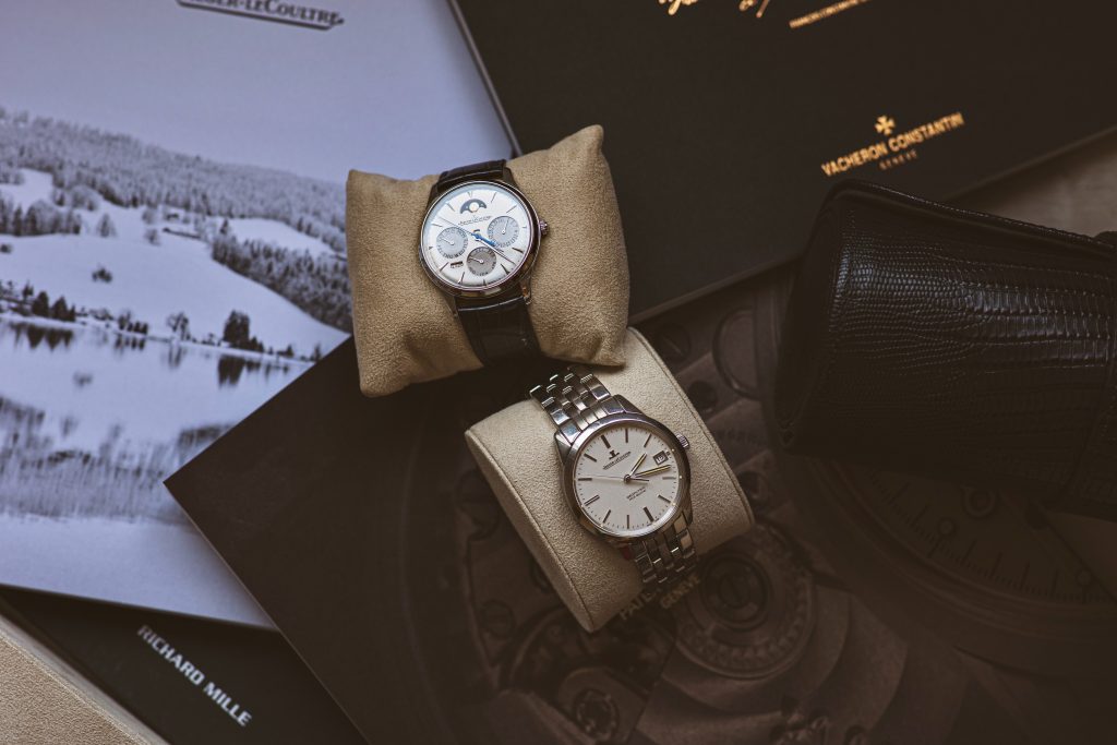 Image of two designer watches on a desk.Luxury watch brand.