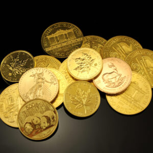 Image of a pile of foreign gold coins against a black background